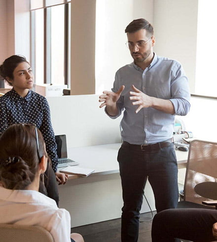 team of agents discussing in office setting