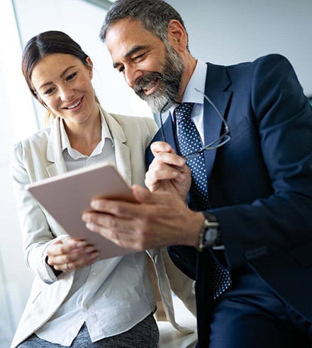 client and agent having discussion around tablet device