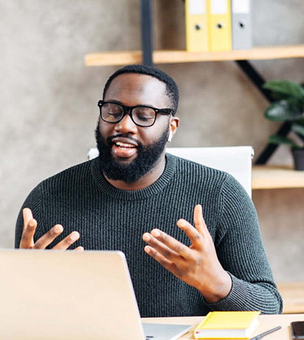 man explaining on video call