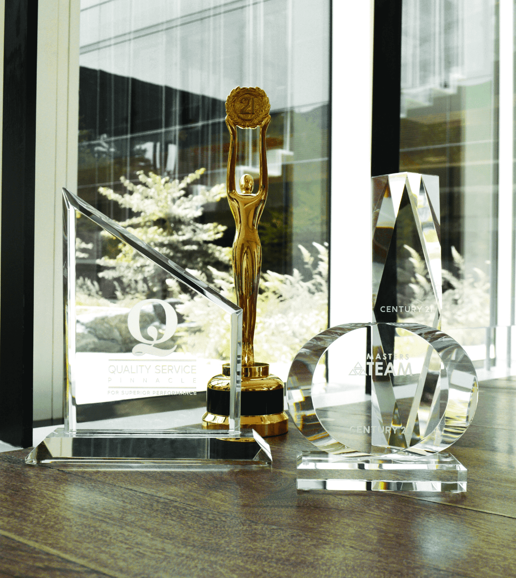 Century 21 awards on oak table